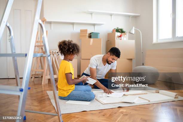 it's their first day in the new house - ikea furniture stock pictures, royalty-free photos & images