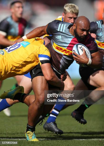 Paul Lasike of Harlequins is tackled by Tom Ellis of Bath Rugby during the Gallagher Premiership Rugby match between Harlequins and Bath Rugby at...