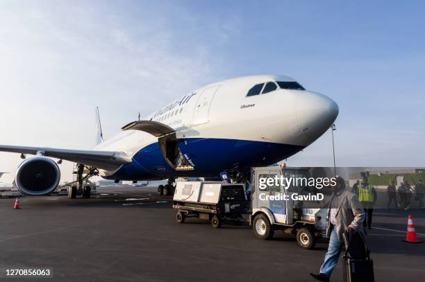 airbus a330-200 of rwandair at kigali airport in rwanda - kigali stock pictures, royalty-free photos & images