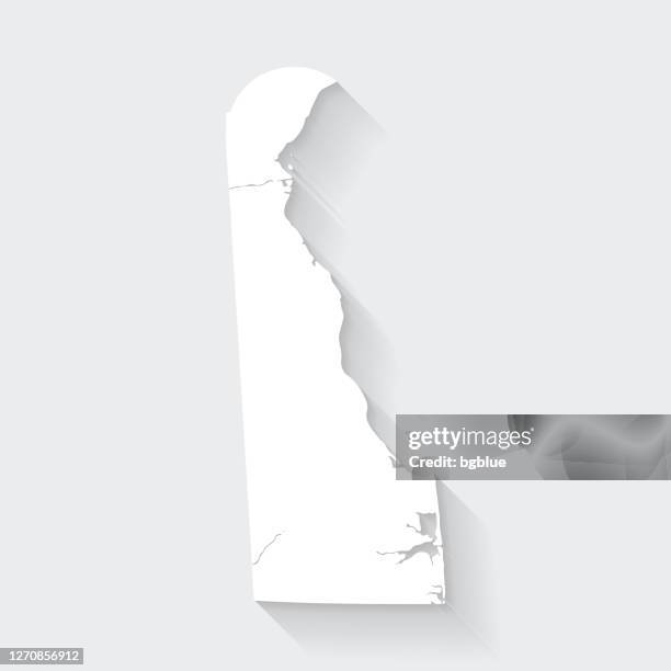 delaware map with long shadow on blank background - flat design - delaware us state stock illustrations