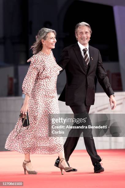 Hanne Jacobsen and Mads Mikkelsen walk the red carpet ahead of the movie "Miss Marx" at the 77th Venice Film Festival on September 05, 2020 in...
