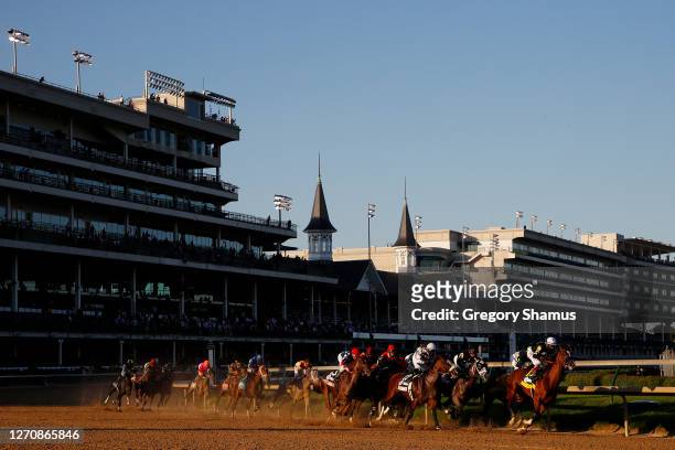 Authentic, ridden by jockey John Velazquez leads the field around the first turn during the 146th running of the Kentucky Derby at Churchill Downs on...