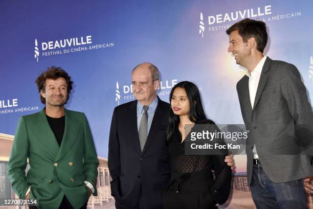 Philippe Lezin, Pierre Lescure his daughter Anna, and Maxime Switek attend the "Pierre & Lescure" photocall at 46th Deauville American Film Festival...