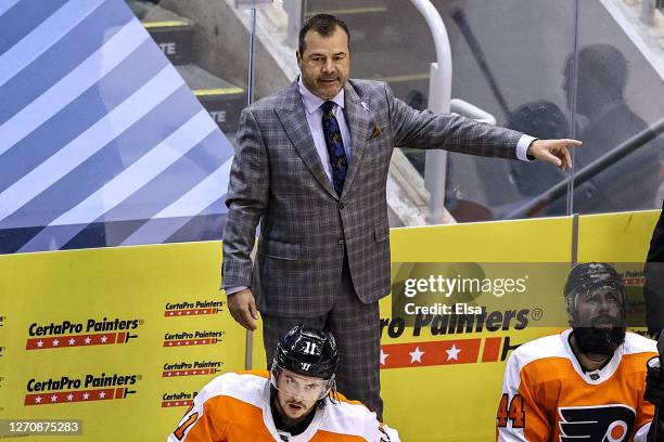 Head coach Alain Vigneault of the Philadelphia Flyers reacts against the New York Islanders during the third period in Game Seven of the Eastern...