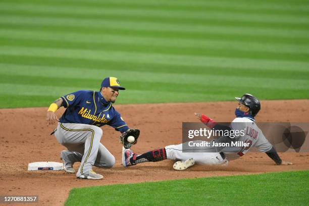 Shortstop Orlando Arcia of the Milwaukee Brewers catches the throw as Francisco Lindor of the Cleveland Indians steals second during the fifth inning...