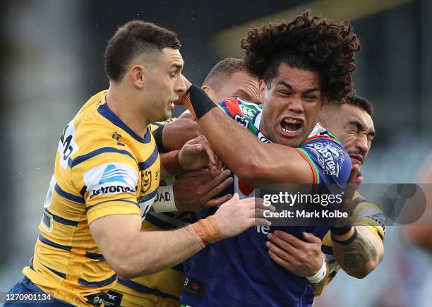 Adam Blair of the Warriors is tackled during the round 17 NRL match between the New Zealand Warriors and the Parramatta Eels at Central Coast Stadium...