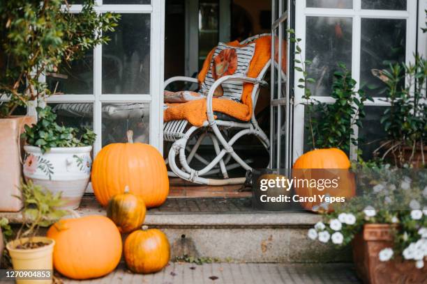 fall and halloween decoration  front porch during october - front porch no people stock pictures, royalty-free photos & images