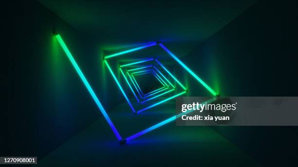 colourful neon lights illuminating tunnel - luce fluorescente foto e immagini stock
