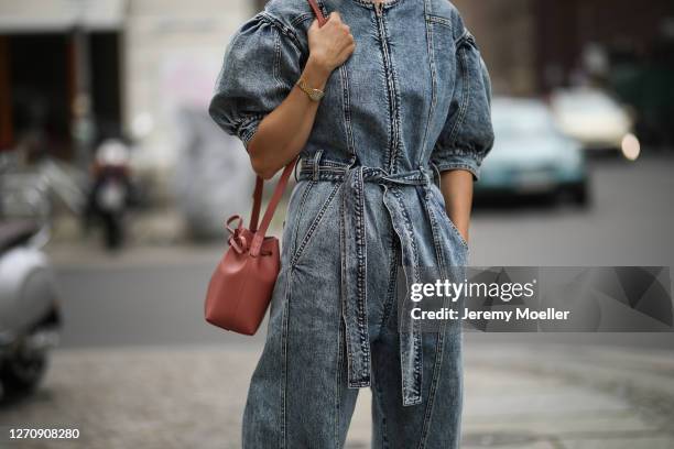 Anna Schürrle wearing Ulla Johnson blue jeans jumpsuits, Rosa Mansur Gavriel bag on September 04, 2020 in Berlin, Germany.