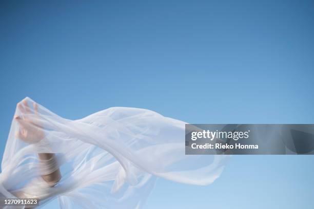 close-up of woman veiled hand - textilien stock-fotos und bilder