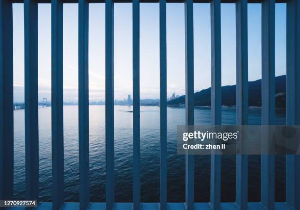 sea view through railings - iron railings stock pictures, royalty-free photos & images