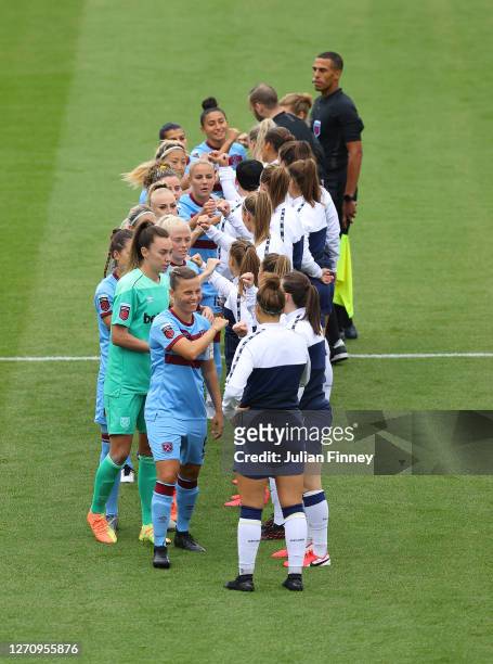 Spurs and West Ham players meet before the Barclays FA Women's match between Tottenham Hotspur and West Ham at The Hive on September 06, 2020 in...