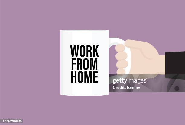 businessman holds a coffee cup with "work from home" text - coffee break stock illustrations