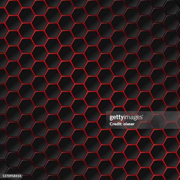 red glow behind hexagon tiles covering surface. honeycomb pattern with individually lit shapes. gradient. - carbon fibre texture stock illustrations