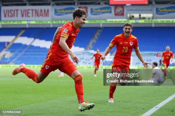 Neco Williams of Wales celebrates with teammate Daniel James after scoring his team's first goal during the UEFA Nations League group stage match...