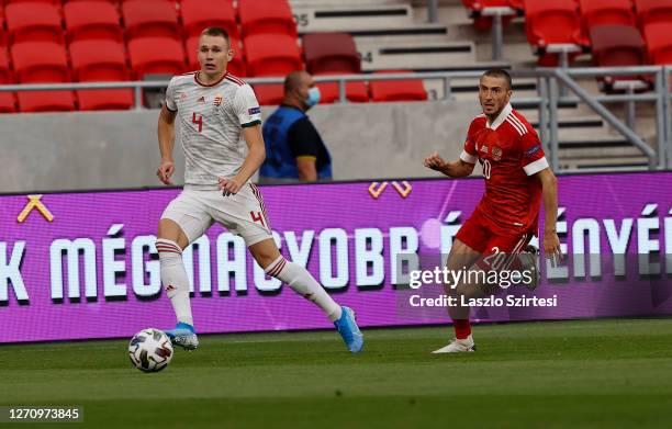 Attila Szalai of Hungary and Aleksei Ionov of Russia in action during the UEFA Nations League group stage match between Hungary and Russia at Puskas...