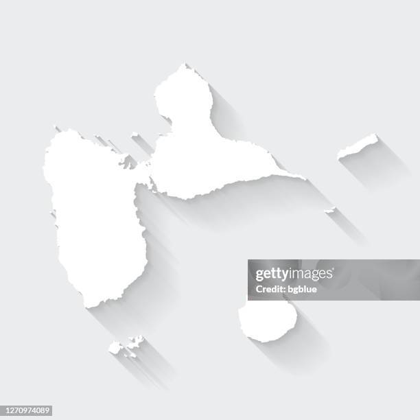 guadeloupe map with long shadow on blank background - flat design - french overseas territory stock illustrations