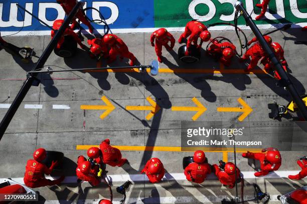 Ferrari team members prepare for a pit stop during the F1 Grand Prix of Italy at Autodromo di Monza on September 06, 2020 in Monza, Italy.