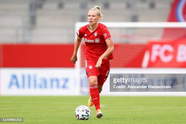 Kristin Demann of FC Bayern Muenchen runs with the ball during the Flyeralarm Frauen Bundesliga match between FC Bayern Muenchen Women and SC Sand...