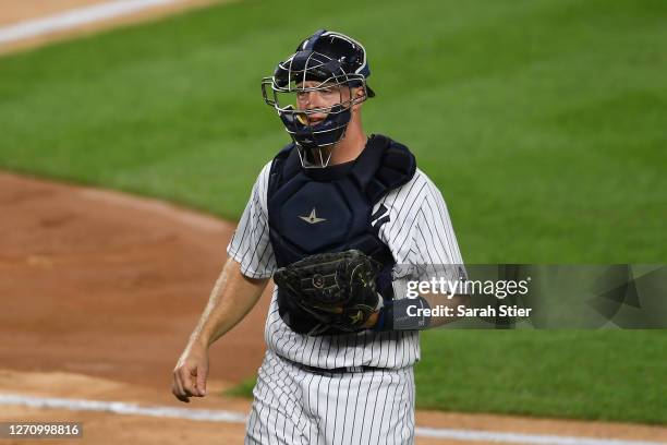 Erik Kratz of the New York Yankees looks on during the second inning of the second game of a doubleheader against the New York Mets at Yankee Stadium...