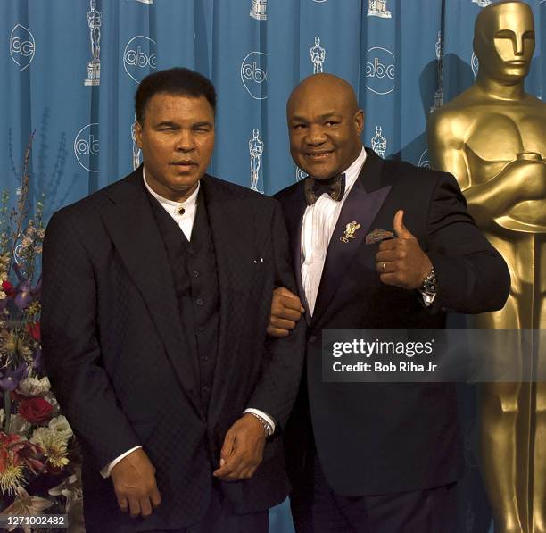 Muhammad Ali and George Foreman backstage at Academy Awards Show, March 23, 1997 in Los Angeles, California.