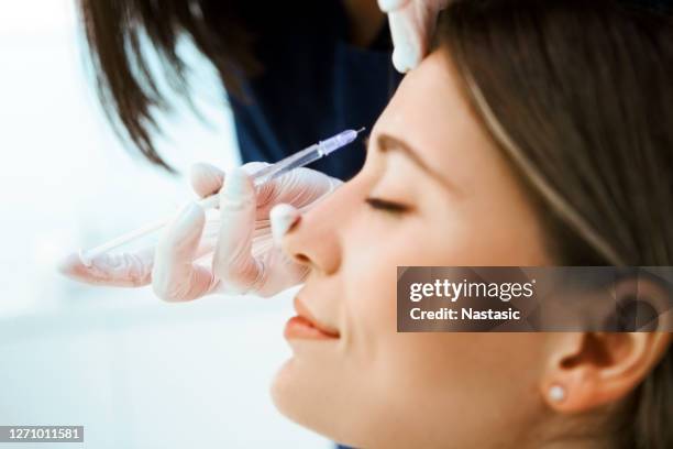 botox injection - beauty shot of young woman stock pictures, royalty-free photos & images