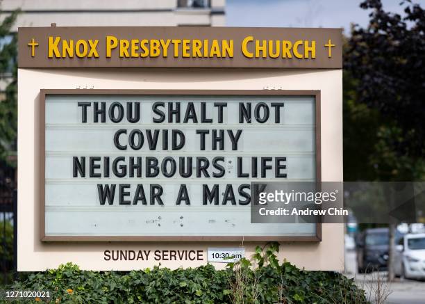 The sign at Knox Presbyterian Church reads, '"THOU SHALT NOT COVID THY NEIGHBOURS LIFE WEAR A MASK" on September 06, 2020 in New Westminster, British...