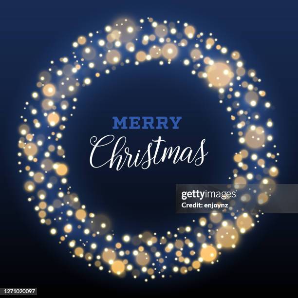 blue and gold christmas wreath fairy lights design - string lights black background stock illustrations