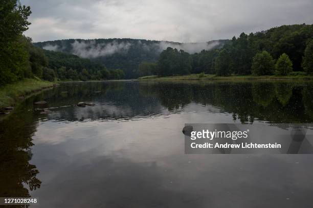 Rain clouds begin to life at dawn along the banks of The Upper Delaware River on August 27, 2020 outside of the small community of Lordsville, New...