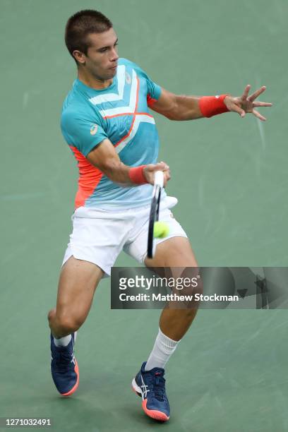 Borna Coric of Croatia returns a volley during his Men’s Singles fourth round match against Jordan Thompson of Australia on Day Seven of the 2020 US...