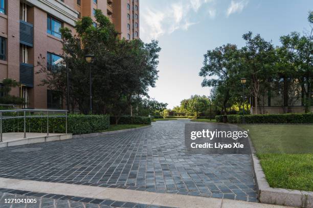 empty street in residential district - concrete footpath stock pictures, royalty-free photos & images