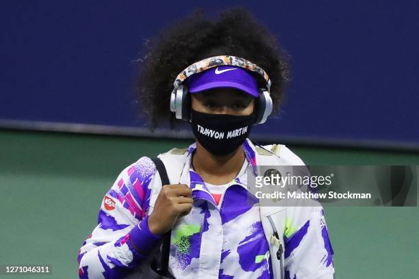 Naomi Osaka of Japan walks out wearing a mask with the name of Trayvon Martin printed on it before her Women’s Singles fourth round match against...