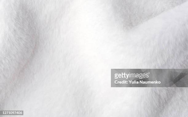 white faux fur texture as background. - white blanket stockfoto's en -beelden