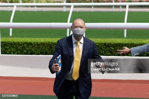 Trainer Chris So Wai-yin celebrates after Bright Kid wins the Race 4 Yi Tung Shan Handicap at Sha Tin Racecourse on September 6, 2020 in Hong Kong.