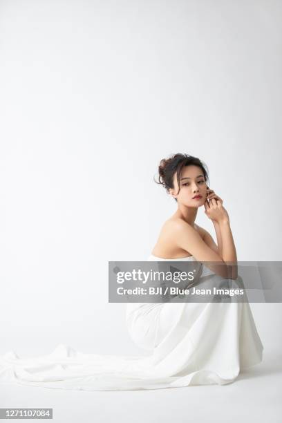 beautiful young woman in evening gown - evening wear ストックフォトと画像