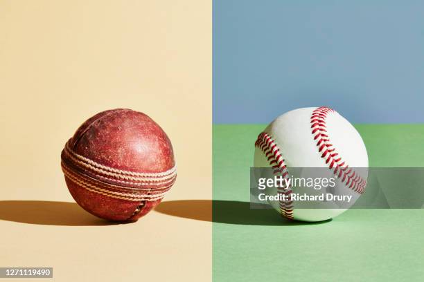 composite image of an old cricket ball and new baseball ball - cricket ball stock pictures, royalty-free photos & images