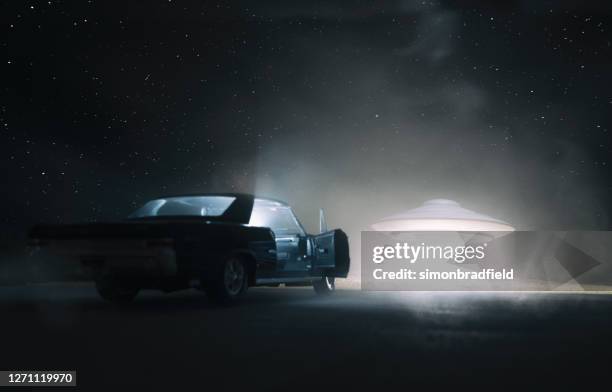 ufo encounter - spooky road stock pictures, royalty-free photos & images