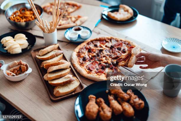 enjoying takeaway meals at home - pizza party stock pictures, royalty-free photos & images