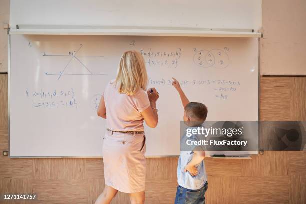 Student Ssolving Math Problem 678 Student Solving Math Problem Stock Photos, High-Res Pictures, and ...