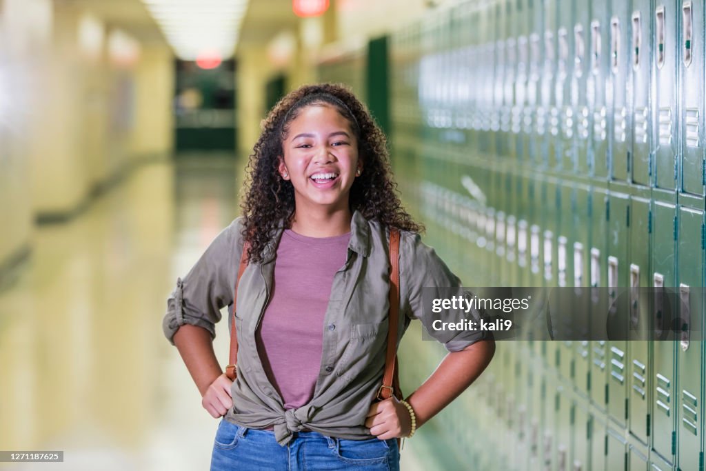 African-American high school student in hallway