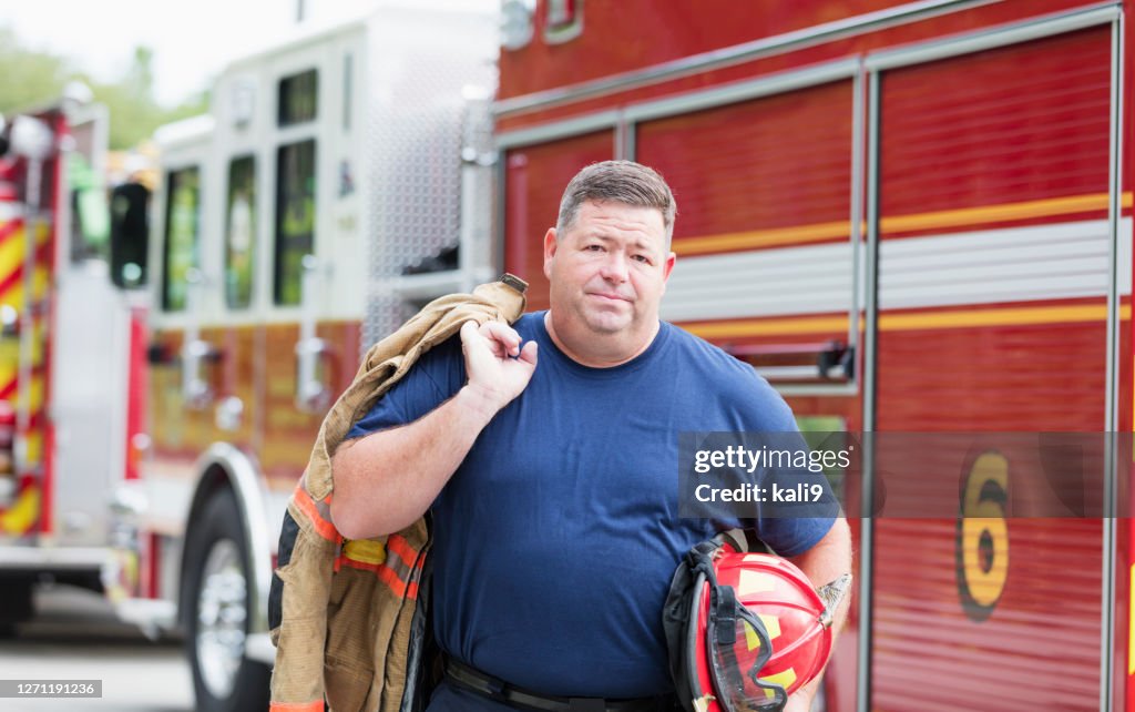 Fire Engine Men Fireman By Fire Engine Carrying Equipment High-Res Stock Photo - Getty ...