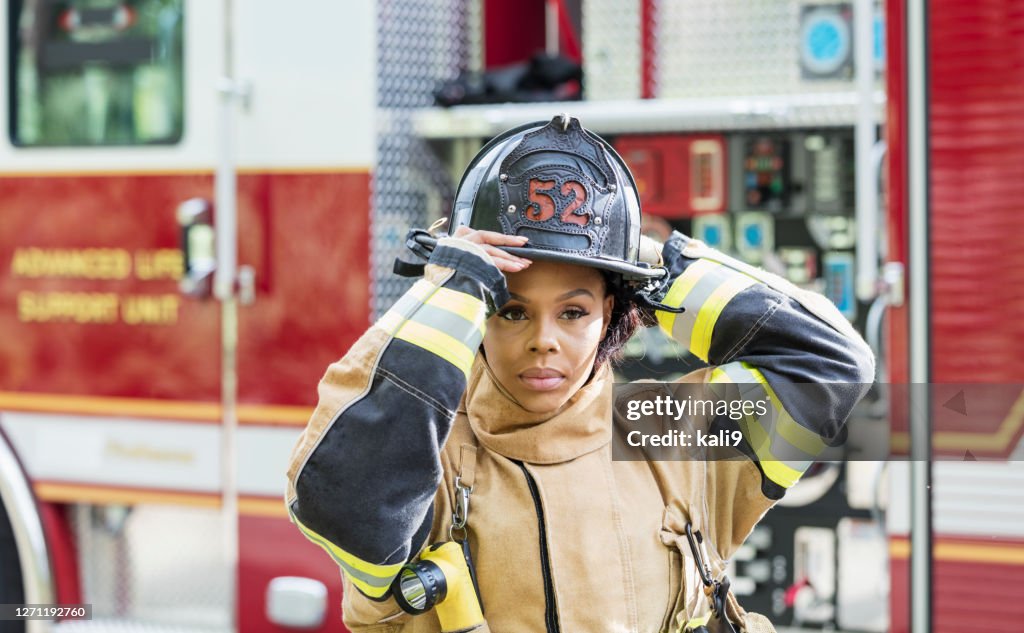 Female firefighter in fire protection suit