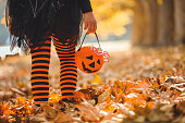 Little girl in Halloween costumes goes to trick or treating