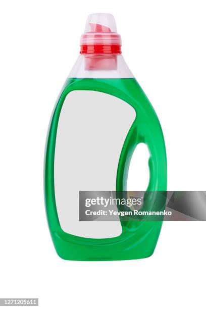 liquid laundry detergent in a transparent plastic bottle with dispenser - sanitizing products stock pictures, royalty-free photos & images