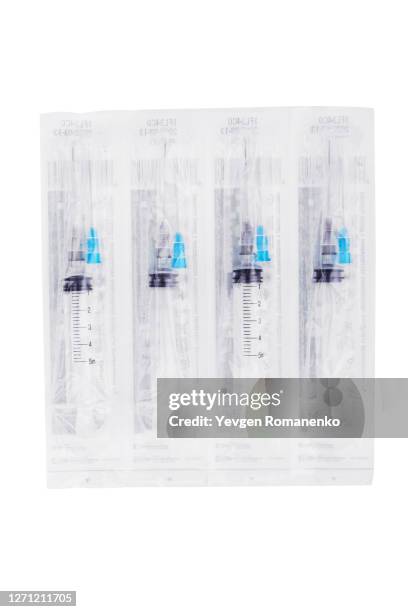 medical syringes in pack isolated on white background - needle injury stock pictures, royalty-free photos & images