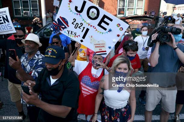 Supporters gather outside the state AFL-CIO headquarters to catch a glimpse of Democratic presidential candidate and former Vice President Joe Biden...