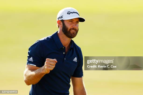 Dustin Johnson of the United States celebrates on the 18th green after winning the FedEx Cup in the final round of the TOUR Championship at East Lake...
