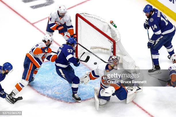 Yanni Gourde of the Tampa Bay Lightning scores a goal past Semyon Varlamov of the New York Islanders during the second period in Game One of the...