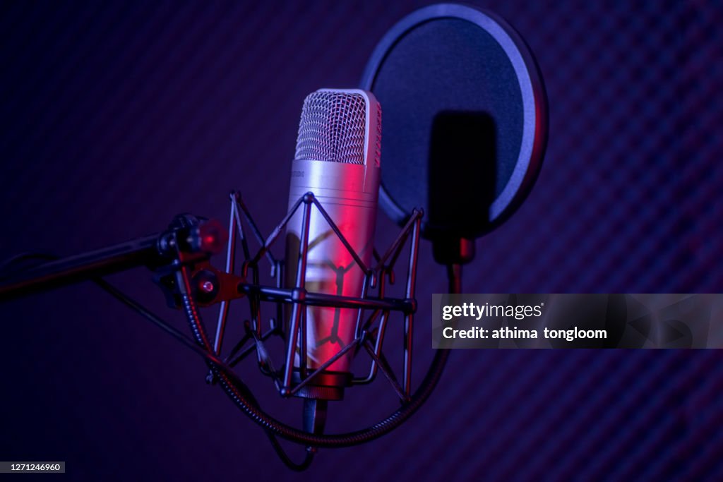 Microphone in radio station broadcasting studio.