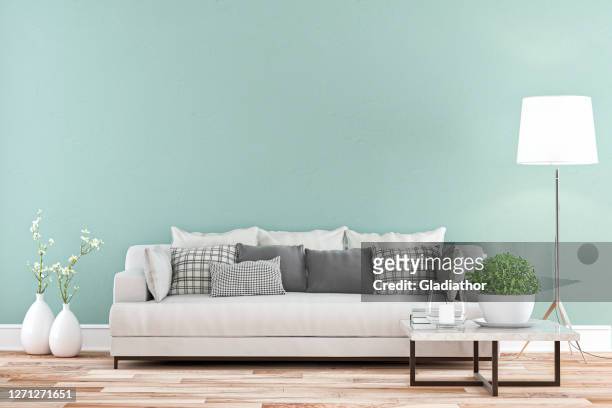 エレガントなリビングルーム(ソファ全体の景色を望む) - 色付きの壁の背景 - ミントグリーン ストックフォトと画像